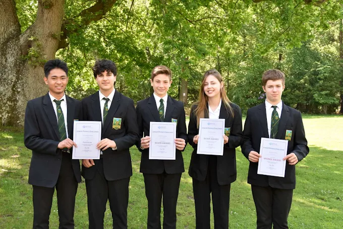 students holding certificates