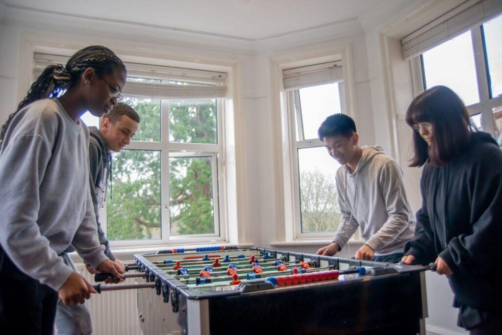 students playing table football